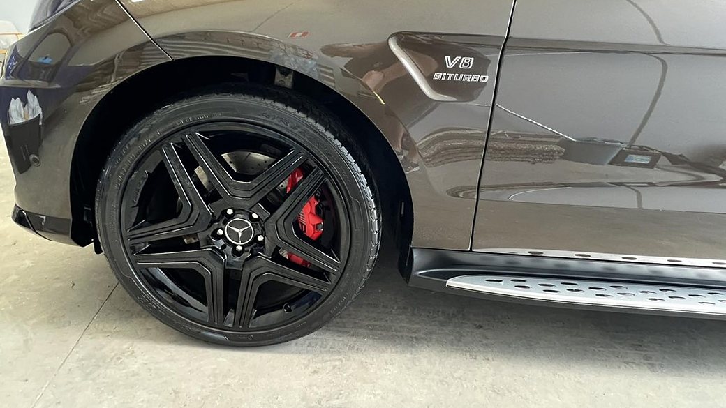 Mercedes-AMG V8 Biturbo wheel with red brake caliper after detailing